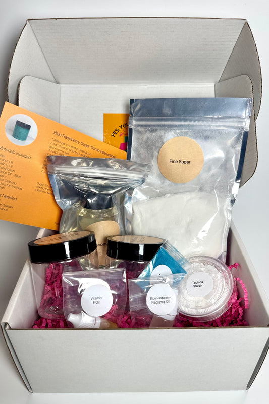 Blue Raspberry Sugar Scrub DIY kit with ingredient bags, two jars, colorful packaging and beginner instructions