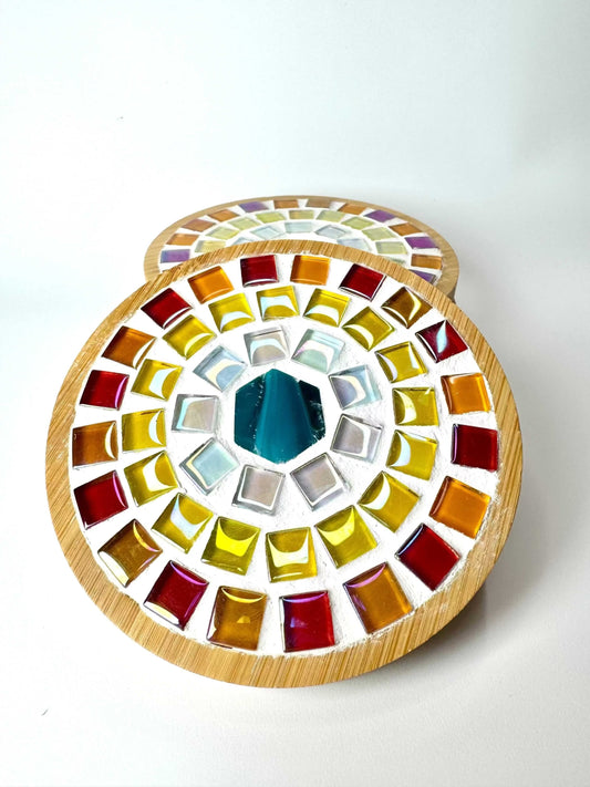 Round Mosaic Tile Coasters with bamboo edges, featuring colourful red, orange, yellow, white and teal mosaic tiles