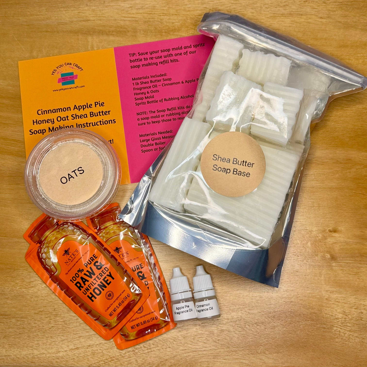DIY Soap Making Refill Kit with shea butter soap base, honey, oats, fragrance oils, and printed instructions.